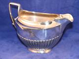 A 19th century sheffield plate cream jug
