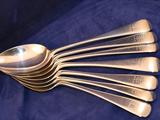 A set of 7 old english pudding spoons