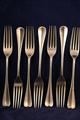 A set of seven Edwardian Hanoverian pattern sterling silver dessert forks