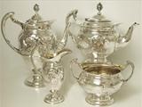 An Antique Victorian English Sterling Silver Four Piece Tea Service Made In The Arts and Crafts Style
