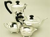A Fine and Impressive Antique English George VI Art Deco Style Sterling Silver Four Piece Tea and Coffee Service