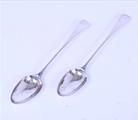 A pair of George III sterling silver serving spoons
