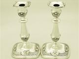 A Fine and Impressive Pair of Antique George V English Sterling Silver Candlesticks