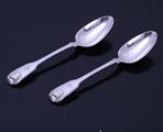 A pair of Victorian fiddle, thread and shell pattern sterling silver table spoons