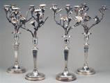 A matched set of four George III silver candelabra