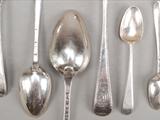 A set of six George III silver feather edge pattern table spoons