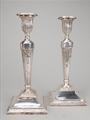 A pair of George III silver candlesticks