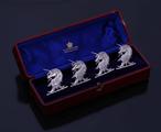 Set of Victorian armorial sterling silver place card holders