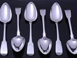 Set of six George III sterling silver fiddle pattern table spoons