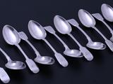 A set of twelve William IV pudding spoons