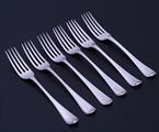 A set of six Regency Old English bead edge pattern sterling silver table forks