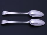 A rare pair of George III sterling silver Hanoverian pattern scrollback spoons