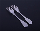 A pair of George IV sterling silver fiddle pattern table forks