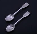 A pair of Victorian fiddle pattern sterling silver teaspoons