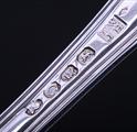 A Regency sterling silver Hourglass pattern dessert spoon