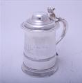 MARITIME INTEREST: A George II silver tankard