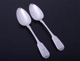 A pair of Regency sterling silver fiddle pattern table spoons