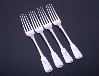 A set of four George IV Scottish fiddle pattern sterling silver pattern table forks