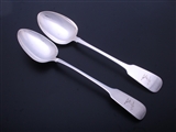 A pair of Irish George IV sterling silver fiddle pattern basting or gravy spoons