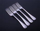 WORTH FAMILY: A matched set of four Old English with thread pattern silver table forks