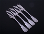 A set of four George III sterling silver fiddle pattern table forks