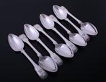 A set of eight George III fiddle, thread and shell pattern sterling silver table spoons