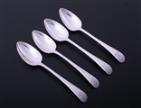 A matched set of four George III Old English pattern sterling silver dessert spoons