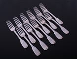 A set of eleven Irish William IV fiddle pattern sterling silver dessert forks