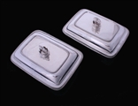 A fine pair of George III sterling silver entree dishes with armorial finials