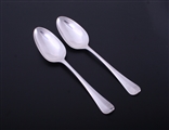 A pair of George III Hanoverian pattern sterling silver table spoons