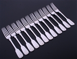 A set of twelve Victorian sterling silver fiddle pattern dessert forks