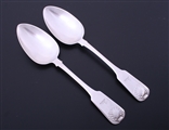 A pair of George III fiddle pattern sterling silver table spoons