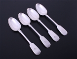 A matched set of four Victorian fiddle pattern sterling silver table spoons