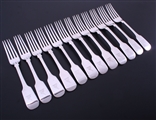 A matched set of William IV and later fiddle pattern sterling silver table forks