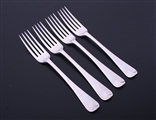 A set of four George III Old English pattern sterling silver table forks