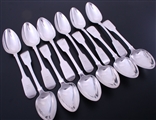 A set of twelve Irish George IV fiddle pattern sterling silver table spoons