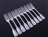 A set of nine Irish George IV fiddle pattern sterling silver table forks