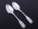 A pair of George III fiddle pattern sterling silver table spoons