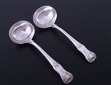 A pair of George IV King's Hourglass pattern sterling silver sauce ladles