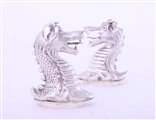 A rare pair of Victorian sterling silver heraldic novelty casters