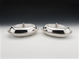 A fine and historic pair of presentation sterling silver entree dishes and covers