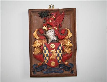 A fine 17th century carved giltwood and polychrome decorated oak armorial panel