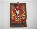 A fine 17th century carved giltwood and polychrome decorated oak armorial panel