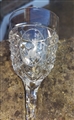 A set of cut glass armorial sherry glasses and a bowl