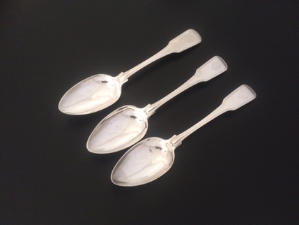 A set of three George III sterling silver fiddle and thread pattern table spoons