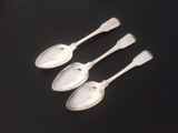 A set of three George III sterling silver fiddle and thread pattern table spoons