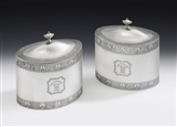THE FAULKBOURN HALL CASED TEA CADDIES. AN IMPORTANT & VERY UNUSUAL PAIR OF GEORGE III TEA CADDIES MADE IN LONDON IN 1793 BY WILLIAM FRISBEE. ALL CONTAINED WITHIN A CONTEMPORARY SATINWOOD CASE, THE HINGES AND HANDLE ALSO HALLMARKED FOR 1793