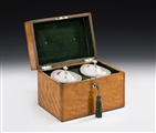 THE FAULKBOURN HALL CASED TEA CADDIES. AN IMPORTANT & VERY UNUSUAL PAIR OF GEORGE III TEA CADDIES MADE IN LONDON IN 1793 BY WILLIAM FRISBEE. ALL CONTAINED WITHIN A CONTEMPORARY SATINWOOD CASE, THE HINGES AND HANDLE ALSO HALLMARKED FOR 1793