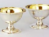 Pair George III round cup-shaped silver salts on foot