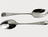 A pair of bright cut dessert spoons